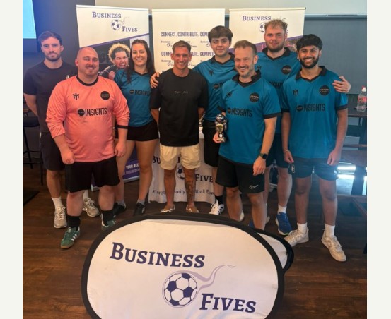 The five-a-side team posing with the runners-up trophy after the Business Fives charity tournament