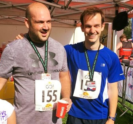 Alistdair and his brother Roger, medals on, at a triathlon ten years ago